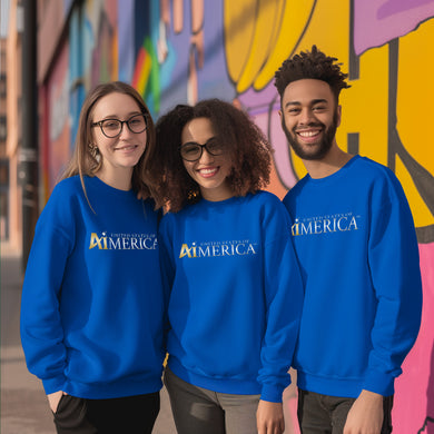 three people wearing blue sweatshirts standing in front of a colorful wall