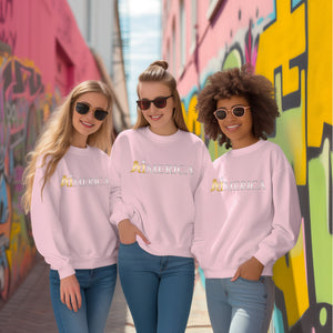 three young women wearing pink sweatshirts and sunglasses